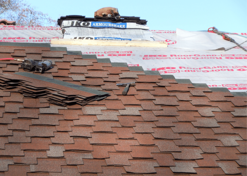 Image of residential shingle roof being installed by Canuck Roofing