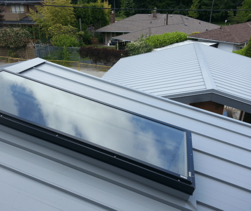 Image of skylight installed on a metal roof by Canuck Roofing.