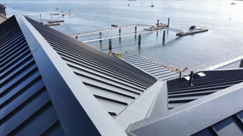 Roof flashing in a metal roof
